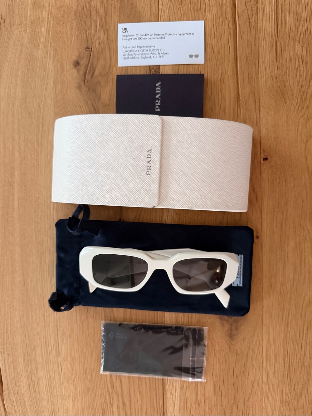 PRADA White Rectangular Sunglasses with Dark Lenses